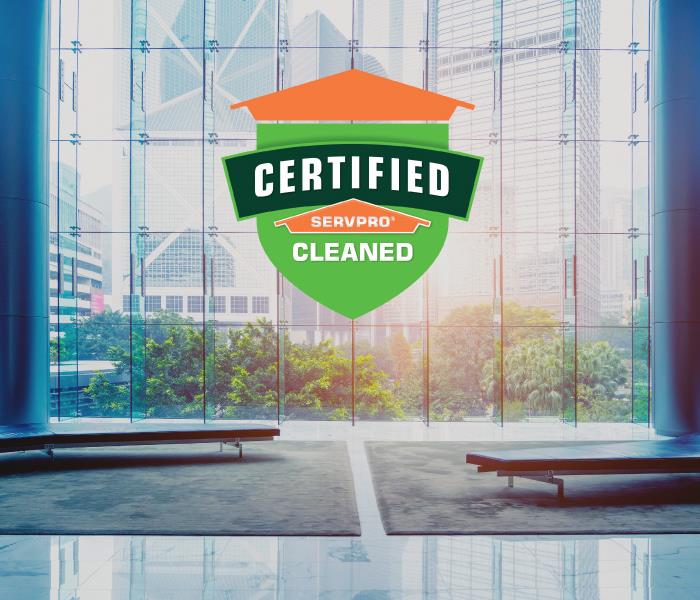 Certified: SERVPRO Cleaned logo on a window