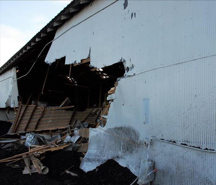 Side of wall damaged by storm