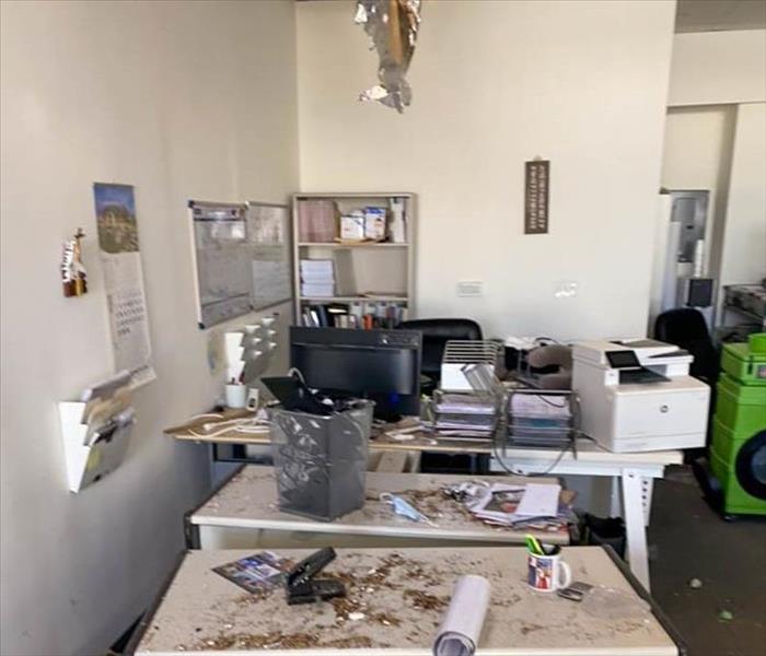 Damages in commercial building after ceiling gave in