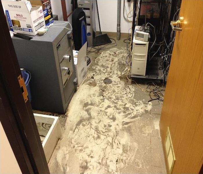 mud on floor of an office, concept of flood damage.